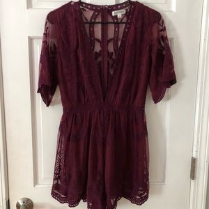 Cute maroon romper with lace patterns